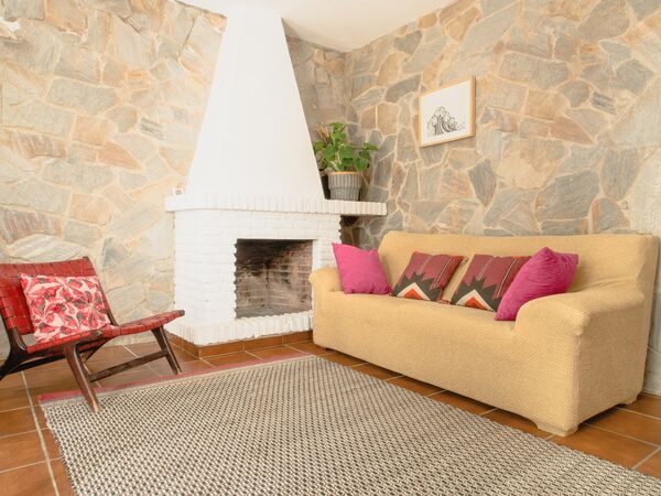 Bright and cosy El Palmar accommodation with living room and fireplace